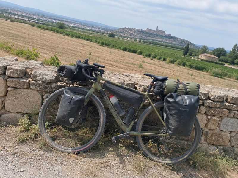 Loaded bike beside dry farmland near Lleida